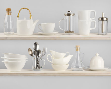Various kitchen utensils on wooden shelves