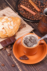 Obraz na płótnie Canvas Coffee cup and croissant