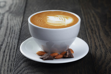 cup of freshly made cappuccino with latte art