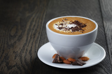 cup of freshly made cappuccino with latte art