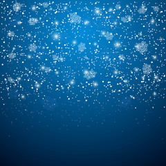 Obraz premium Blue Christmas background with snowflakes