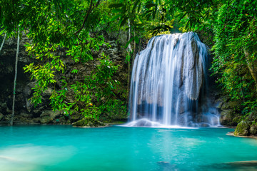 Fototapeta na wymiar Waterfall in the tropical forest in Thailand