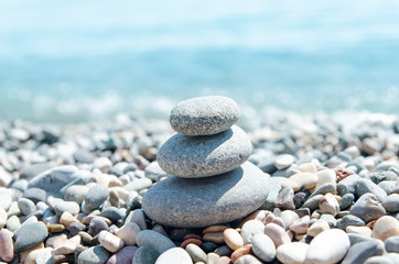 Fototapeta na wymiar three stones on stack near sea. zen like concept