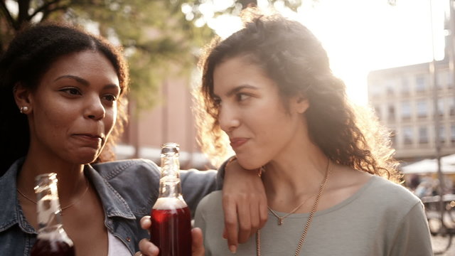 Mixed Race Girl Friends Drinking Pink Lemonade Drinks Together O