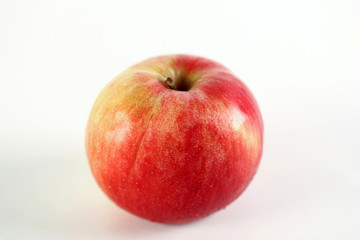 Fresh red apple on a white background