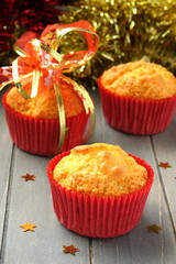 Muffins in red cups with christmas decoration