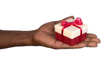 Man holding a gift box in hand isolated on white