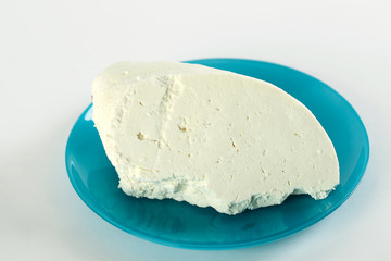 White cheese on a blue azzure plate