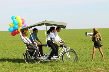 woman leading 4 guys on a quad bike