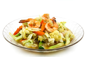 Stir-fried vegetables with shrimp on a plate.