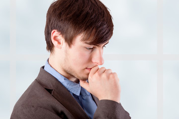 Young businessman in thinking