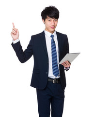 Businessman hold with tablet and finger point up