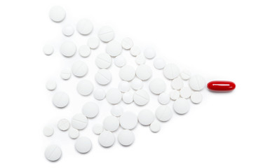 Red pill with white tablets, isolated. Healthcare concept 