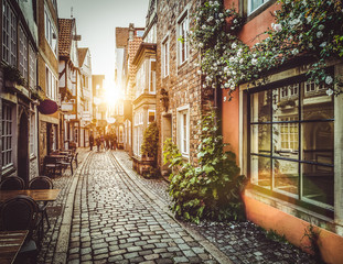 Fototapeta na wymiar Old town in Europe at sunset with retro vintage filter effect