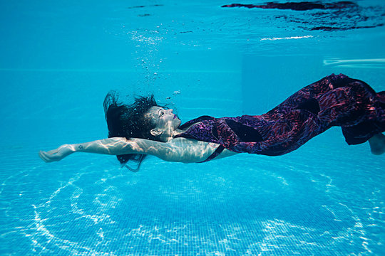 Beautiful woman swiming underwater