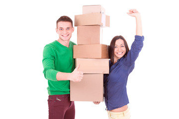 Young couple holding boxes. Moving to a new apartment or house.