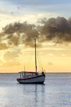 Fishing boat in sunset off Curacao coast