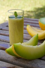 A glass of banana-melon smoothie.