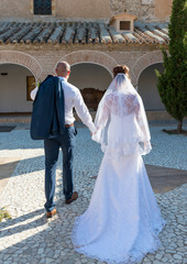 Bride and Groom in a Spanish Courtyard in the Sunshine