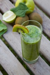 Spinach-kiwi-green apple smoothie in the glass.