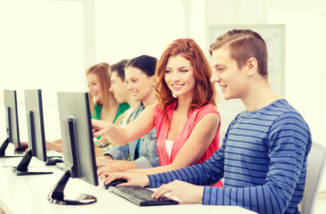 female student with classmates in computer class