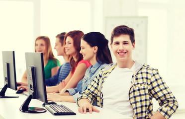 Fototapeta premium male student with classmates in computer class
