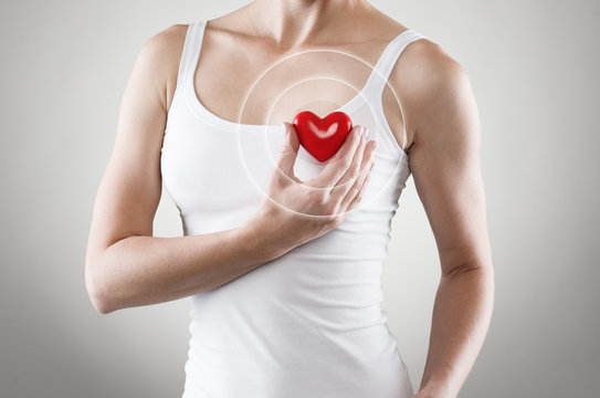 Heart shape in woman's hands. Cardiovascular medicine