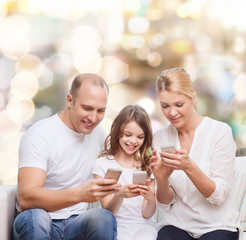 happy family with smartphones