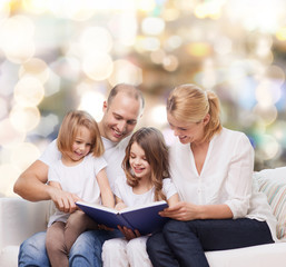happy family with book at home
