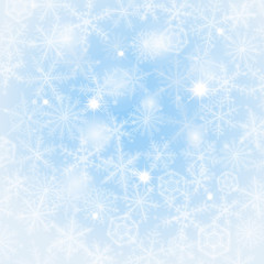 Light blue winter background made from snowflakes