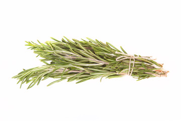 Bunch of rosemary tied up twine on a white background