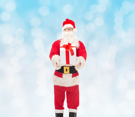 man in costume of santa claus with gift box