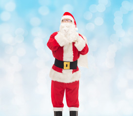 man in costume of santa claus with bag