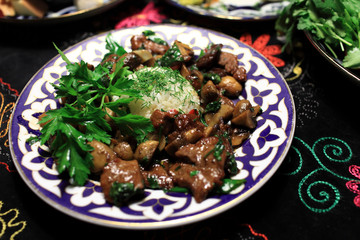 Plate with roast veal and mushrooms