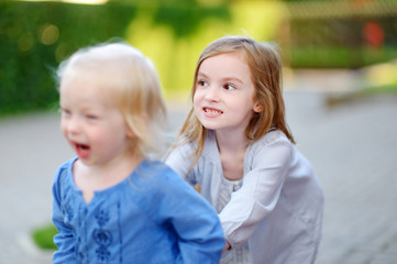 Two little sisters having fun on a summer day © MNStudio