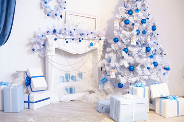 Christmas tree, fireplace, watches, toys, gifts in a white room