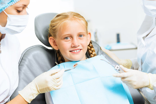 Dentist inspecting patient