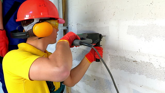 	 Happy group people in builder uniform indoor