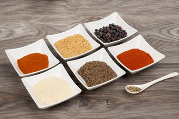 various spices on wooden table