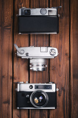 Vintage camera on wooden background