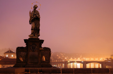 Fototapeta na wymiar Sculpture of the sacred John Nepomucene on Karlovy Bridge