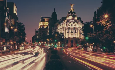Poster Het Metropolis-gebouw bij nacht, Madrid. © Oleg Podzorov