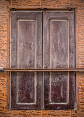 Brown shutter of a moroccan building