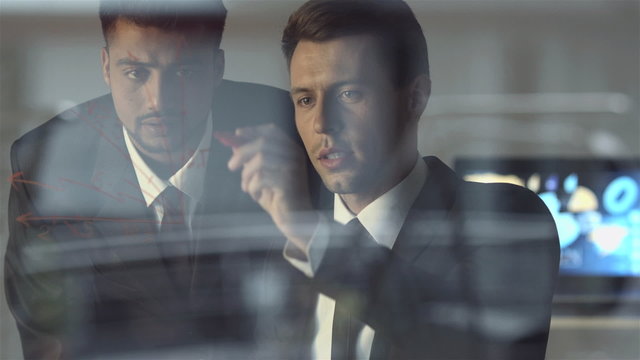 The office workers discuss the project at the virtual screen