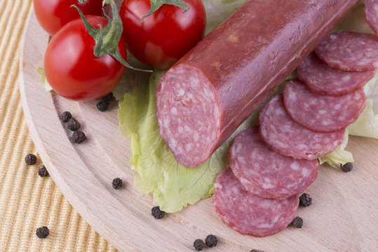 sliced salami with Cherry tomato and seasoned with black pepper