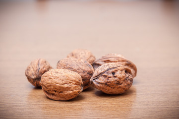 Some walnuts on a table. Vintage style