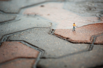 figure toy playing guitar in the rain.