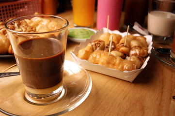 hot coffee with milk in the glass,asian traditional coffee.