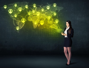 Businesswoman in office with tablet and social network world map