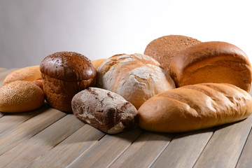Fresh bread on table on white background